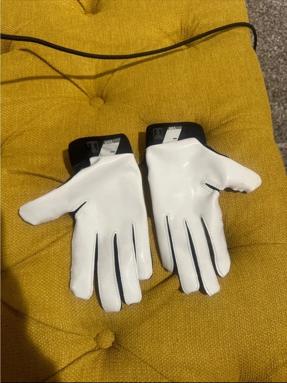 Nike youth medium Black and White football Gloves